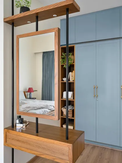 The highlight of this daughter's bedroom is the custom vanity unit with a suspended mirror, which also acts as a partition for the wardrobe area.