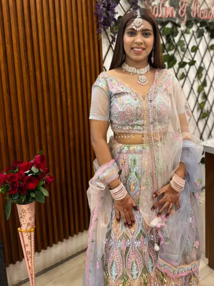 Ready for the party. This client looks stunning in a multi-color pastel lehenga, complete with matching jewellery, perfect for a sangeet or reception.