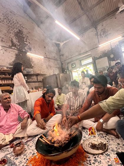 A moment of shared devotion during the havan ceremony. The smoke from the sacred fire fills the studio as we come together to celebrate Ganesh Chaturthi with traditional rituals.