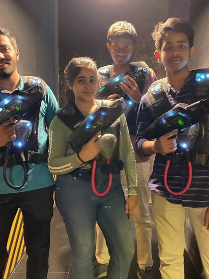 A group of friends ready for a laser tag battle.