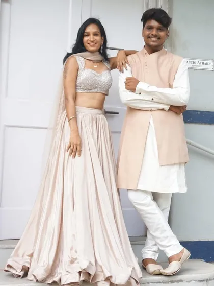 Getting you and your partner ready is my specialty. Here’s a great example of our coordinated couple outfits. She’s in a simple, elegant lehenga and he’s in a matching bandhgala. You’ll look like the perfect pair without any effort.