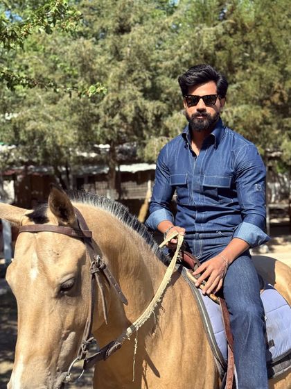 A powerful image of our client on horseback, dressed in our durable and stylish denim wear. It’s a testament to the versatility of our custom clothing.