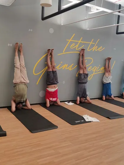 We love a good challenge! Here, the team at LinkedIn tries out supported headstands during a workshop. My sessions often include playful elements like this to build confidence and encourage teamwork in a fun, supportive environment.