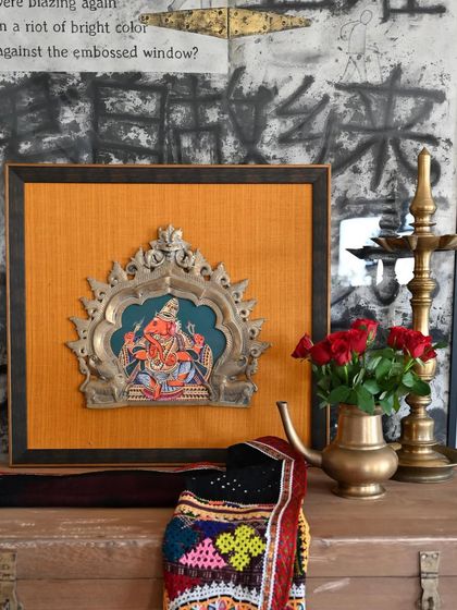 The framed Ganesha Prabhavali, styled on a console table. This project was a wonderful opportunity to give a cherished family piece a new life and a new story.