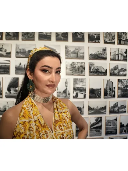 A closer look at the Indian Express feature styling. The intricate print of the outfit is balanced with a modern choker and oversized earrings, creating a powerful and confident image.