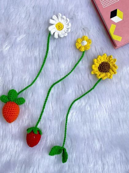 A fun and cute set of bookmarks, including a daisy, a sunflower, and even a little strawberry and carrot. Perfect for adding a touch of whimsy to your reading.