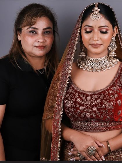 One of my talented students standing proudly with her model after completing the bridal makeup exam. This is the moment their hard work pays off.