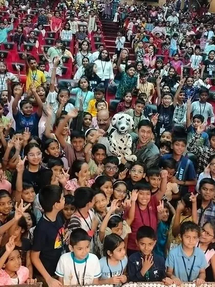 The energy from a live audience is everything. This picture, filled with the smiling faces of children and families at a Lokmat Campus Club event, is why I do what I do. My goal is to create joy and laughter for audiences of all ages.