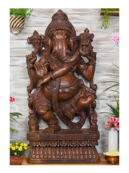The 25-inch Mangalahara Ganapathi shown in a festive setting with flowers, illustrating its suitability for celebrations and pooja.