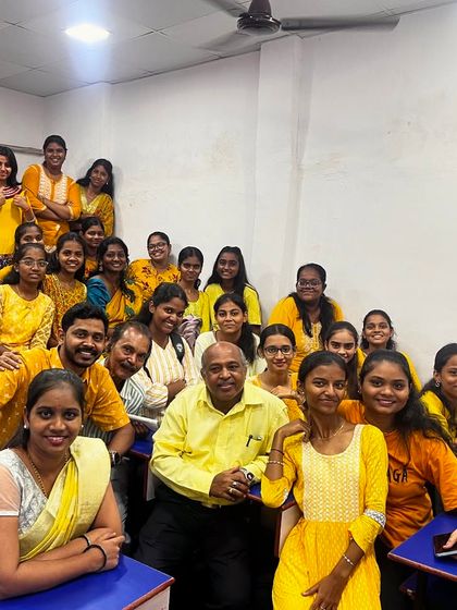 Our students and teachers come together for a group photo, all dressed in yellow to celebrate the first day of Navratri 2024.