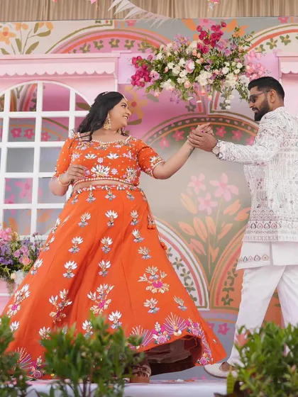 The Mehandi ceremony should be full of life and color. I designed this vibrant, carnival-themed backdrop with whimsical patterns and bright florals, creating a joyful stage for Amoolya and Vaibhav to dance and celebrate.