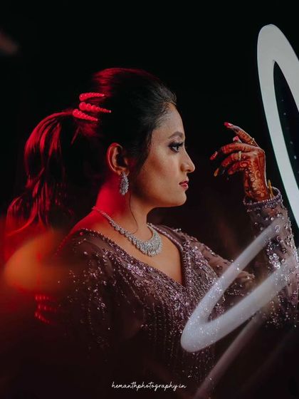 A creative bridal portrait using a ring light for a futuristic, artistic effect. I enjoy experimenting with light to create unique images.