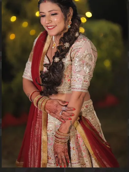 A close-up shot capturing the delicate embroidery on the blouse and the happy glow of my client. It’s these details that make a custom-tailored outfit truly stand out.