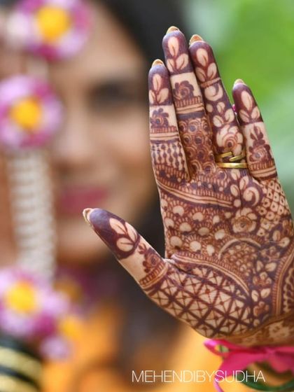 This artistic shot highlights the beautiful leaf patterns on the fingers, with the stain looking exceptionally dark.
