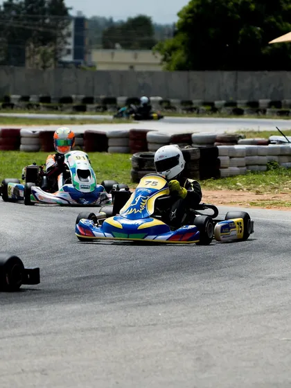 Our number 75 kart leads a competitor through a corner.