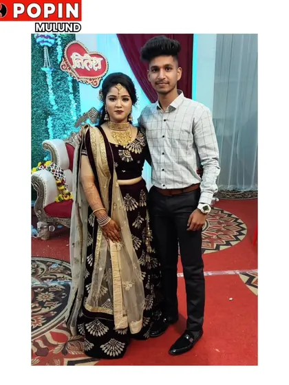 A happy client looking regal in a deep velvet lehenga for her special event. This shows how my rental outfits bring joy and elegance to real celebrations.