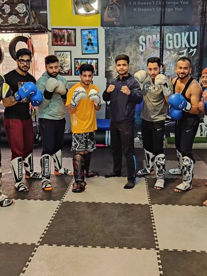 The kickboxing crew geared up and ready to train. A diverse group of individuals united by a common goal.
