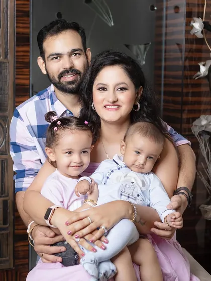 A beautiful, complete family portrait. Everyone is looking at the camera, but the feeling of connection and love is still so strong.