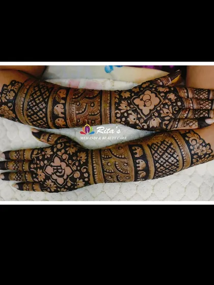The back of the hands for the customized engagement mehendi, featuring elegant floral and elephant motifs.
