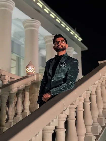 The same velvet blazer, captured on a grand staircase, adding a touch of royalty to the look.
