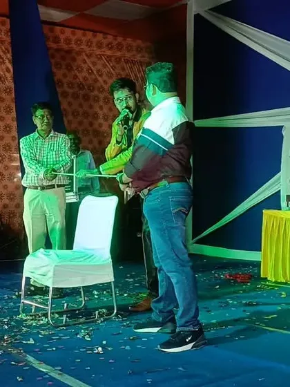 A volunteer from the audience is on stage, participating in a mind-boggling illusion during the Shalimar Garden show.