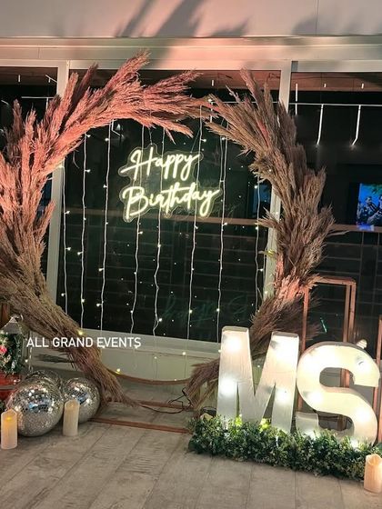 Another angle of the pampas grass setup, showing different marquee initials ('MS') to demonstrate how I customize the decor for each client.