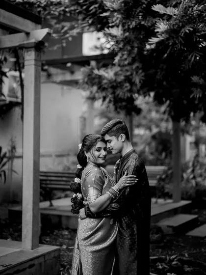 A romantic embrace in a garden setting. This black and white portrait of Apeksha and Rutwij feels classic and intimate.