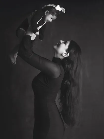 The powerful connection between a mother and her child, captured in a timeless black and white portrait. These sessions focus on emotion and the simple, profound beauty of your bond.