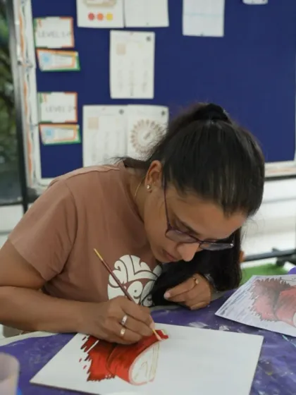 Learning to paint with acrylics is a great starting point for beginners. This student is working on a vibrant piece in our 8-week course.