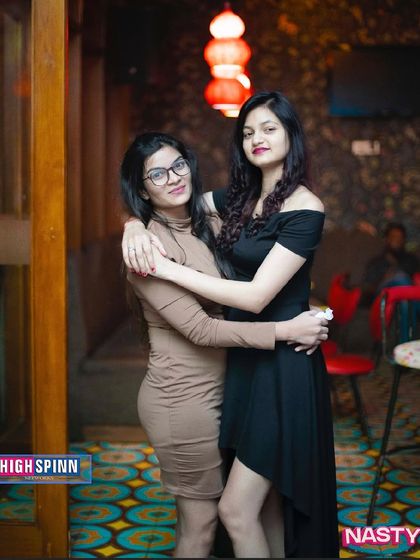 Two friends enjoying the Wednesday night party at Badmaash Lounge.