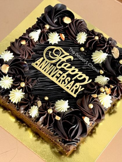 A customized brownie slab for an anniversary. I decorate my classic chocolate brownie slab with elegant piping to turn it into a celebration cake.