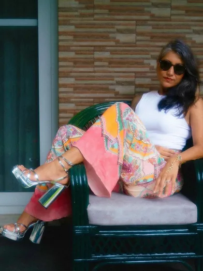 Throwing it back to the 70s with these printed flared pants and platform heels. This look demonstrates my range for retro and vintage-inspired fashion shoots, creating a cool and relaxed vibe.