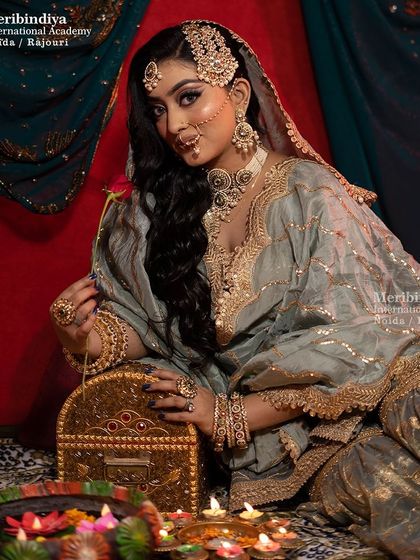 This image shows the bride in a traditional setting, complete with diyas. You'll learn to create makeup that fits perfectly within a culturally rich theme.