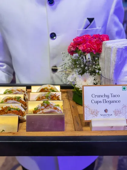 Crunchy Taco Cups Elegance. A tray of mini tacos, perfectly assembled and presented with flair by our service team.