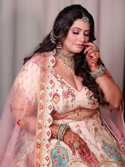 A close-up of the plus-size bride, her expression full of grace and serenity. A truly beautiful bridal portrait.