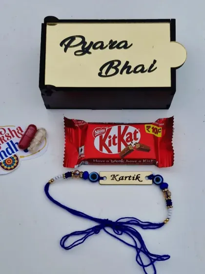 A sweet and simple Rakhi mini combo. It comes with an evil eye name rakhi, a "Pyara Bhai" wooden box, chocolate, and a Raksha Bandhan card.