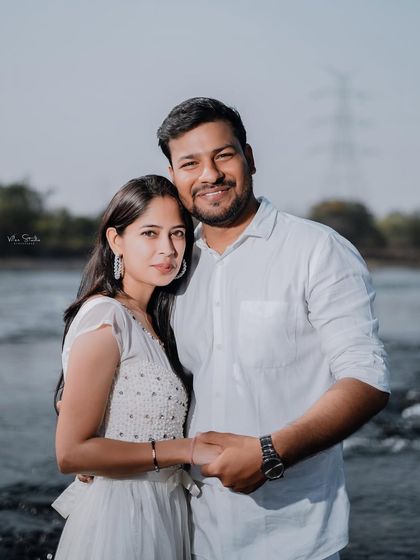A classic couple portrait by the river. This shot is simple, elegant, and focuses completely on the connection between the two of them.