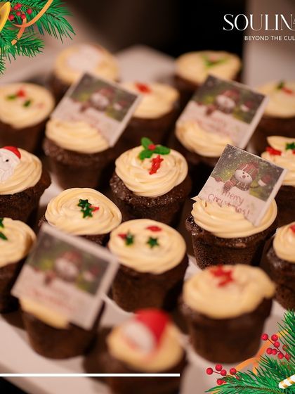 Festive Christmas cupcakes with themed decorations, perfect for a holiday celebration. We create sweet treats that are both delicious and visually charming.