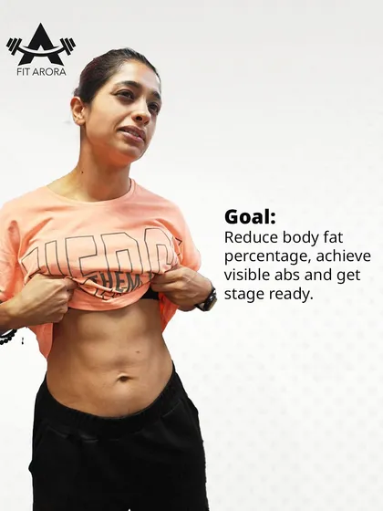 Preeti's goal was clear: reduce body fat, achieve visible abs, and get stage-ready. This photo shows her incredible abdominal definition, a result of consistent dieting and training.