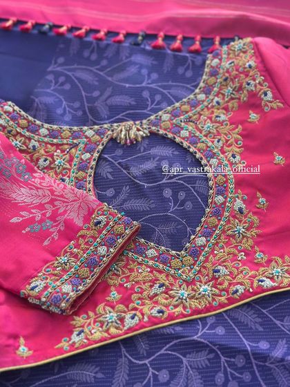 The back of the pink blouse, with a keyhole cutout.