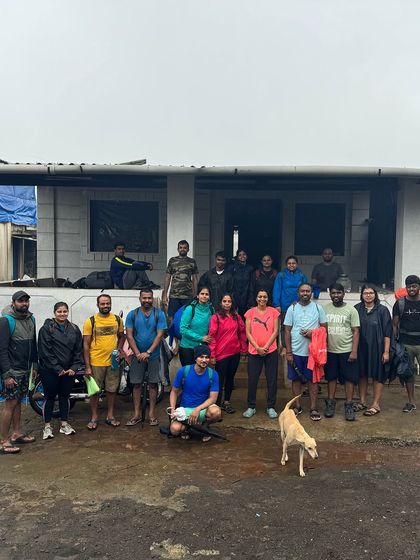 The group outside their homestay in a small village in Maharashtra, ready to start the day's trek.