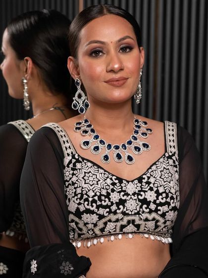A gorgeous client showcasing a modern diamond and sapphire style necklace. Our rental jewellery collection includes contemporary pieces perfect for gowns and Indo-Western outfits.