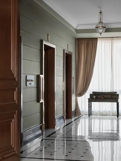First impressions begin the moment the lift doors open. For this expansive office lobby, I aimed for a cinematic feel, using a calm sage green and custom black-and-white marble flooring to create a grand, yet welcoming, prelude to the creative world inside. This is where timeless elegance meets contemporary sophistication.