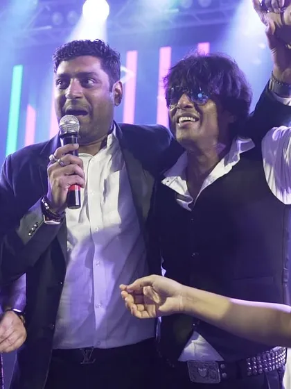 A moment of appreciation on stage with one of the event organizers. Mutual respect and collaboration lead to the best shows.