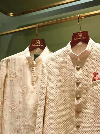 A classic pairing for any celebration. This look features a textured ivory bandhgala jacket with subtle embellishments and a fine kurta, showcasing our dedication to clean lines and understated elegance in groomswear.