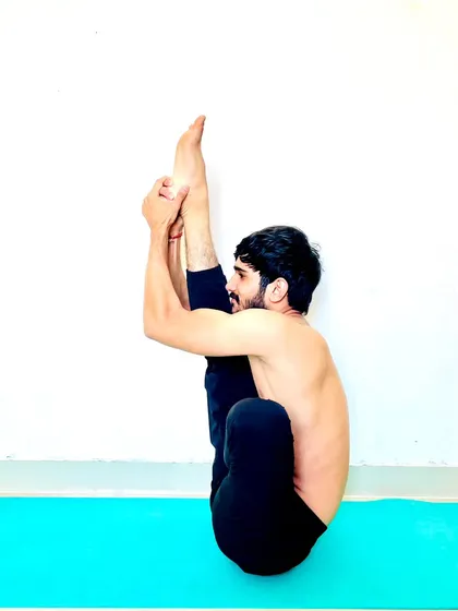 Another deep seated forward bend, showing the flexibility of the spine and hamstrings.
