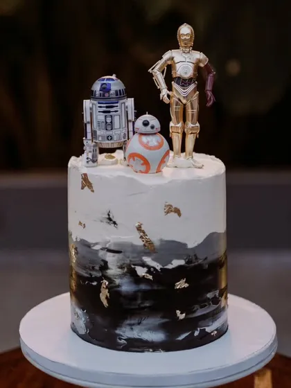 A unique, personalized wedding cake featuring Star Wars characters R2-D2, C-3PO, and BB-8. I love incorporating fun and personal details that tell your unique story as a couple.