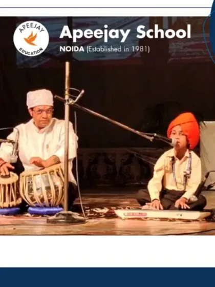 A young student plays the keyboard while another accompanies on the tabla, showcasing the musical talent nurtured at our school. This performance was a beautiful part of our tribute to Guru Nanak Dev Ji.