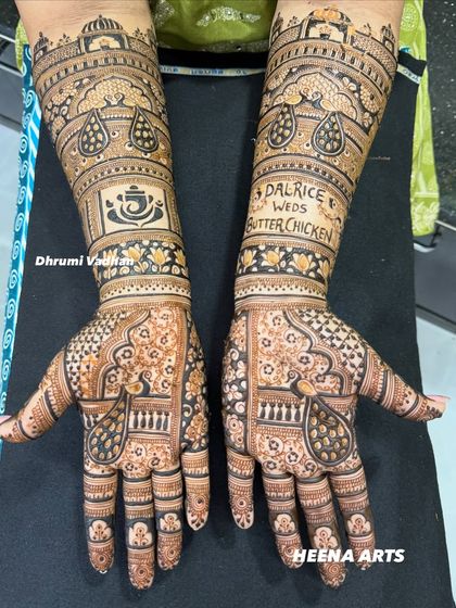 I absolutely love creating fun and quirky designs. This bride's love story was captured with the unique hashtag "Dalrice weds Butterchicken," making her mehendi truly one of a kind.