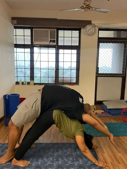 Here I am acting as the base for a student in a supported backbend. This partner stretch helps to safely open the chest and spine far more than one could alone.